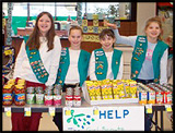 Girl Scouts sell items for charity at a Kroger charity table!